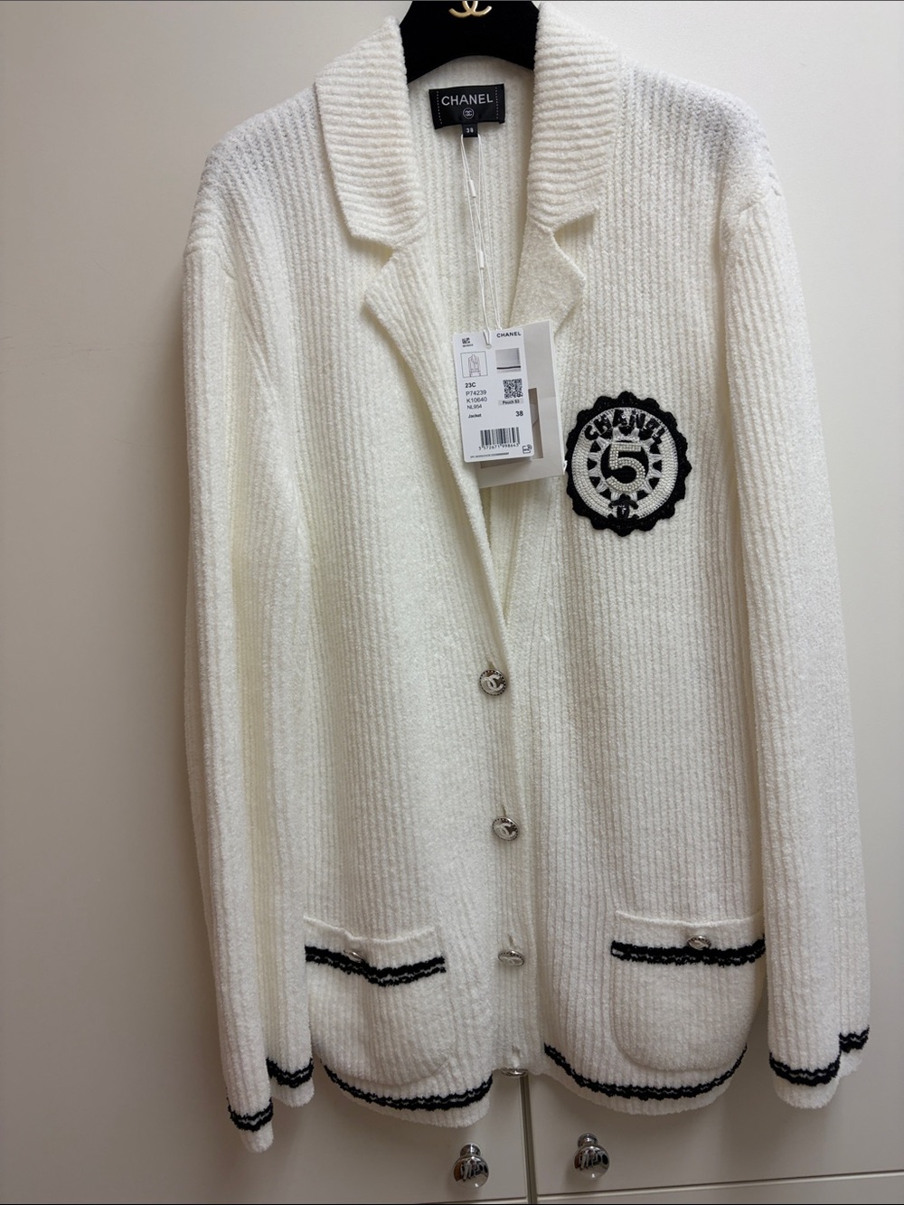 CHANEL Cream Cardigan Sweater with Black Trim and Patch